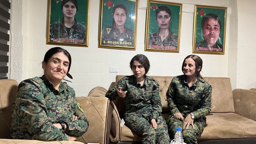 YPJ Commander in Chief Rojhelat Afrin pictured at YPJ headquarters near Al-Hasakh with YPJ spokesperson Heval Roksana and YPJ Field Commander Heval Kurdistan, Nov. 23, 204.