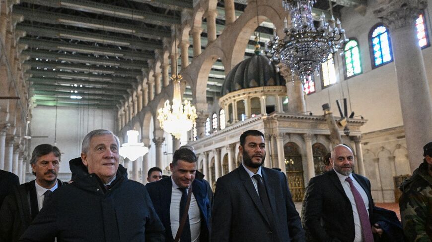 Italian Foreign Minister Antonio Tajani (2nd L) visits the eighth-century Umayyad Mosque in the old city of Damascus 