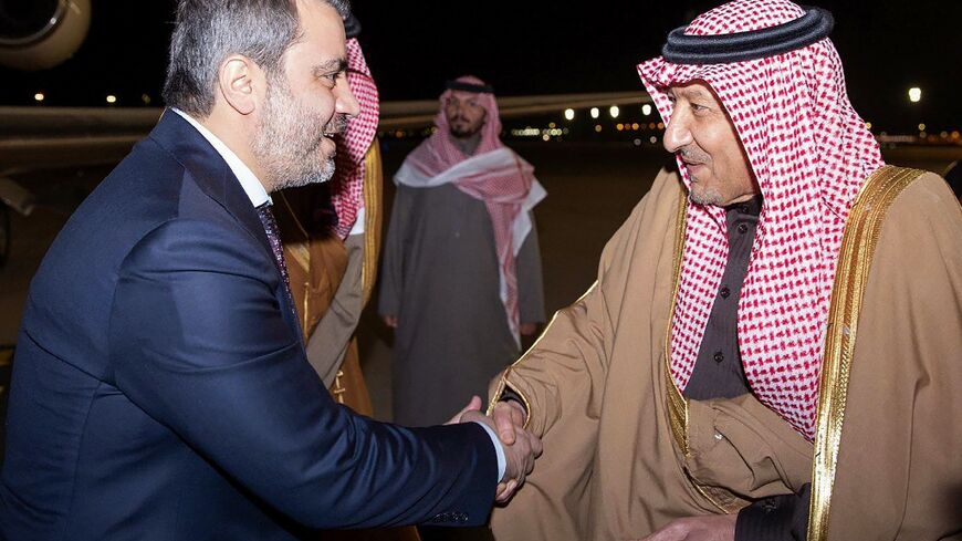 Syrian Foreign Minister Assaad al-Shibani (L) is welcomed to Saudi Arabia on his transitional government's first foreign visit since Islamist-led rebels toppled longtime ruler Bashar al-Assad last month