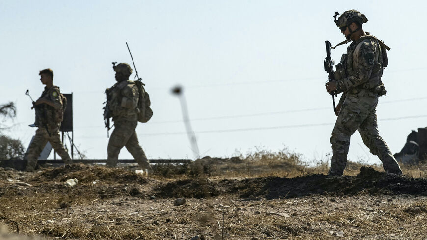 US soldiers inspect the site of reported Turkish shelling days earlier on an oil extraction facility on the outskirts of Rumaylan, in Syria's Kurdish-controlled northeastern Hasakeh province on Oct. 28, 2024. 