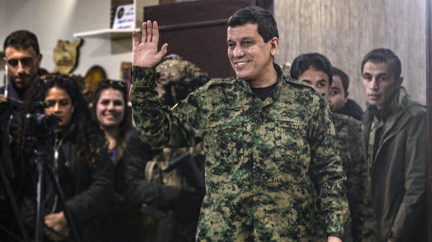 Syrian Democratic Forces (SDF) commander-in-chief Mazloum Kobane waves after giving a press conference in Syria's northeastern city of Hasakeh on Dec. 6, 2024.