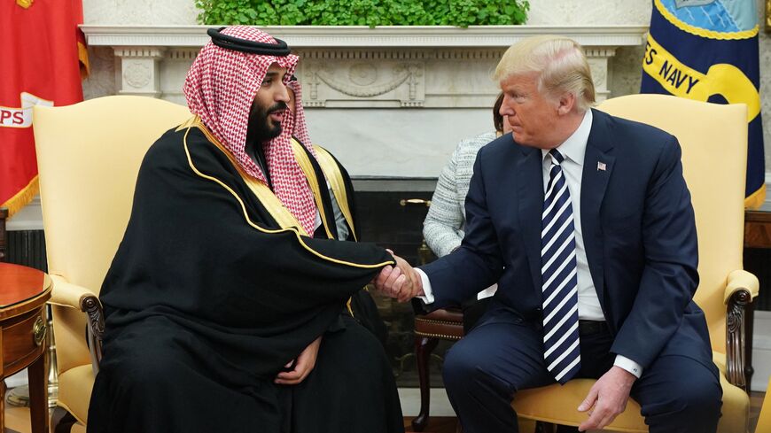 US President Donald Trump (R) shakes hands with Saudi Crown Prince Mohammed bin Salman in the Oval Office of the White House, Washington, DC, March 20, 2018.