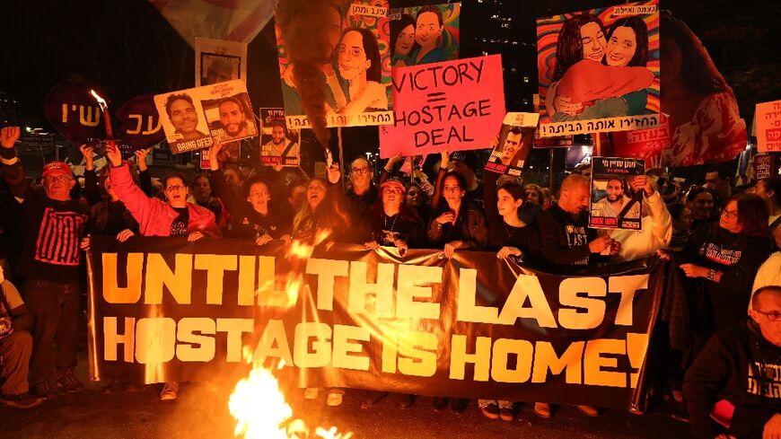 Anti-government protesters outside the defence ministry in Tel Aviv