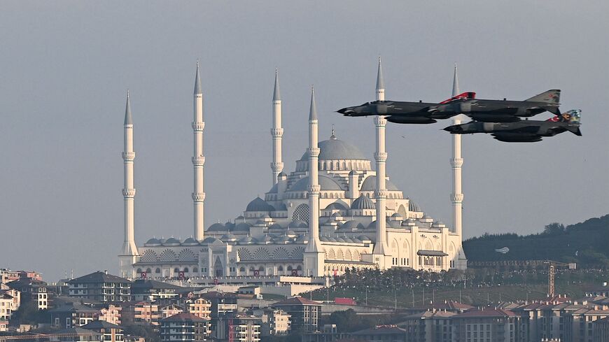 Turkish Air Force fighter jets perform a military parade over the Bosphorus on Oct. 29, 2023. 