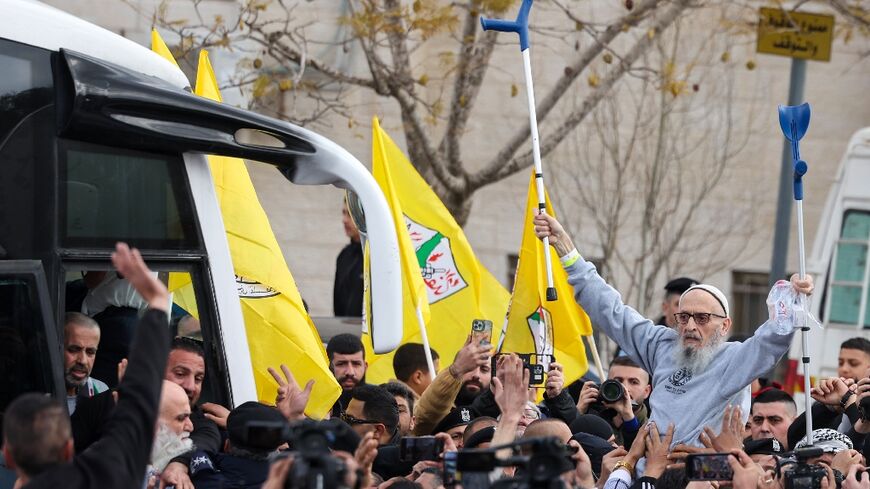 A jubilant crowd greeted a busload of freed Palestinian prisoners in Ramallah on Saturday