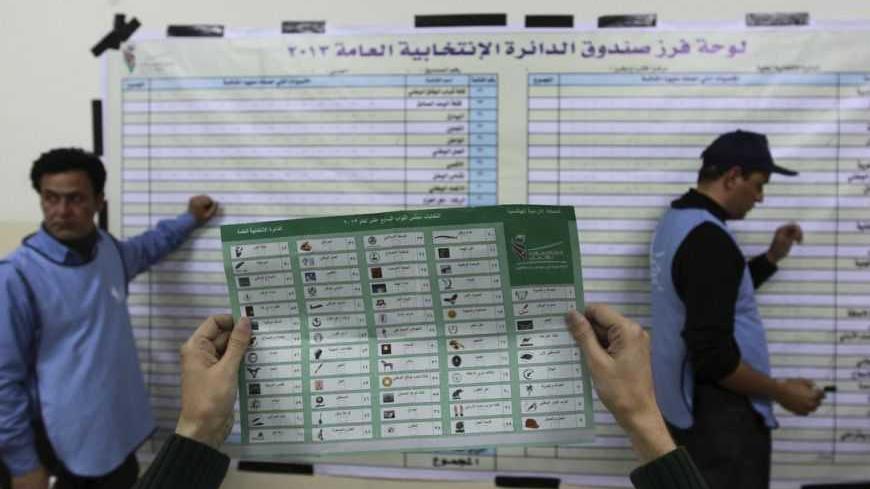 Officials count ballots after polls closed at a polling station in Amman January 23, 2013. Polling stations opened on Wednesday in Jordanian elections boycotted by the Muslim Brotherhood, which says the electoral system is rigged in favour of tribal areas and against the large urban centres. Eyewitnesses reported queues of about a dozen people apiece at several polling stations across the kingdom just before the polls opened at 7 a.m. (0400 GMT). REUTERS/Muhammad Hammad (JORDAN - Tags: POLITICS ELECTIONS)