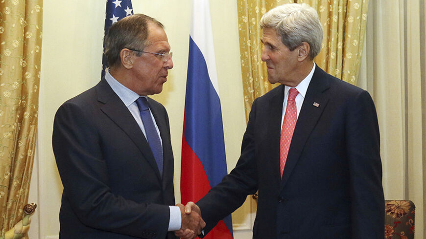 Russian Foreign Minister Sergey Lavrov and U.S. Secretary of State John Kerry (R) shake hands as they pose for a photograph prior to a bilateral meeting on the sidelines of the closed-door nuclear talks with Iran, in Vienna November 23, 2014. REUTERS/Ronald Zak/Pool (AUSTRIA - Tags: POLITICS) - RTR4F8JO