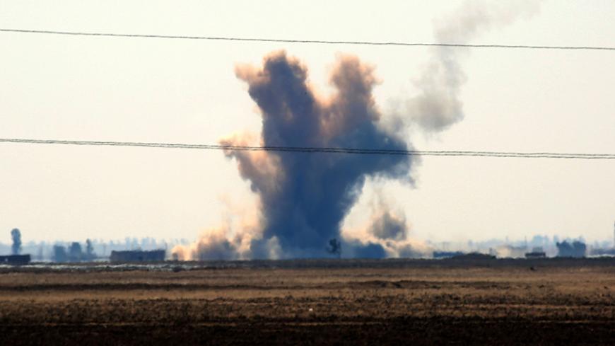 A general view shows smoke rising in the distance after fighters from the US-backed Syrian Democratic Forces (SDF), made up of an alliance of Arab and Kurdish fighters, fired a mortar launcher from the village of Sabah al-Khayr on the northern outskirts of Deir Ezzor as they drive to encircle the Islamic State (IS) group bastion of Raqa on February 21, 2017.
The SDF made a major incursion into the oil-rich province of Deir Ezzor as part of their push for Raqa, field commander Dejwar Khabat said. 



 / AFP 
