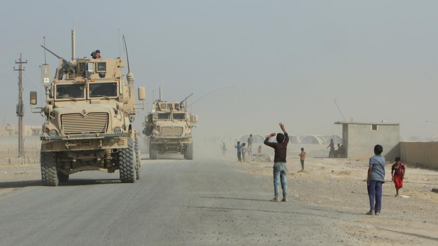 U.S. military and Iraqi army reinforcements deploy after the defeat of the Islamic State militants in Qayyara, Iraq, August 29, 2016. Picture taken August 29, 2016. REUTERS/Azad Lashkari  - S1AETYKITNAB