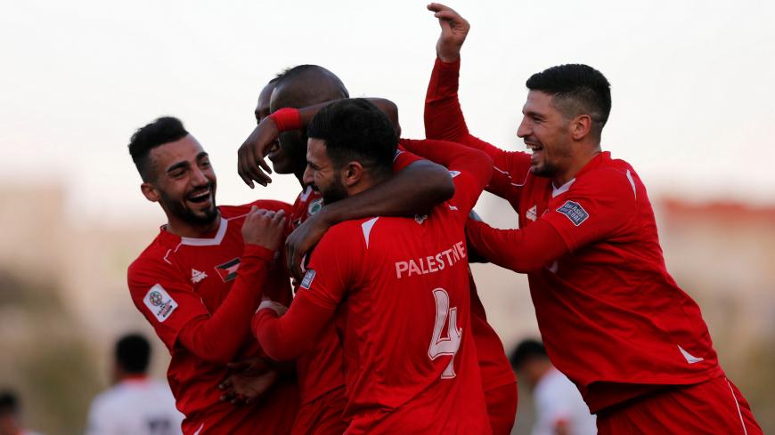 Soccer Football - AFC Asian Cup Qualifiers - Palestine vs Bhutan - Hebron, Palestinian Territories - October 10, 2017 Palestine's players celebrate after scoring. REUTERS/Mohamad Torokman - RC1A16BBC980