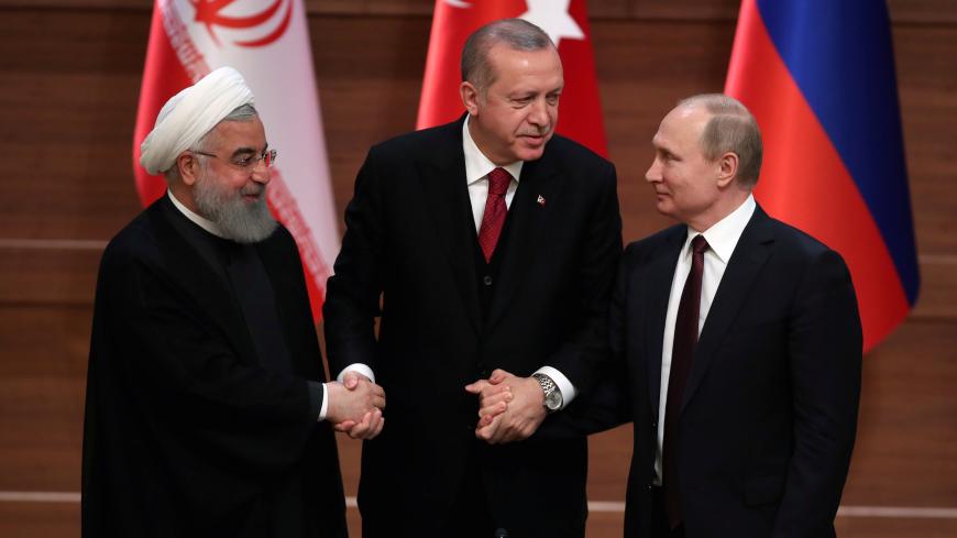 Presidents Hassan Rouhani of Iran, Tayyip Erdogan of Turkey and Vladimir Putin of Russia hold a joint news conference after their meeting in Ankara, Turkey April 4, 2018. REUTERS/Umit Bektas - RC17DDDED670