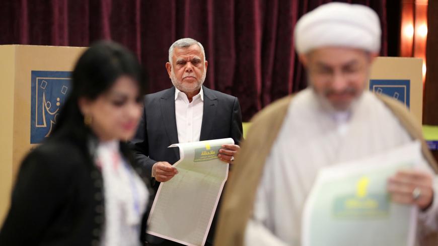 Leader of the Conquest Coalition and the Iran-backed Shiíite militia Badr Organisation Hadi al-Amiri prepares to casts his vote at a polling station during the parliamentary election in Baghdad, Iraq May 12, 2018. REUTERS/Ahmed Jadallah     TPX IMAGES OF THE DAY - RC1EA048C760