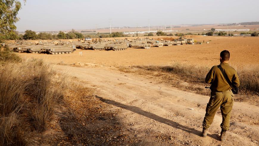 An Israeli soldier stands near a staging area near the border with Gaza, in southern Israel November 14, 2019. REUTERS/ Ronen Zvulun - RC21BD9513VS