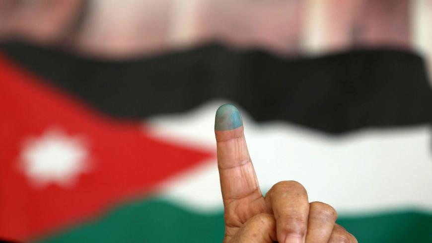 A Jordanian woman shows her ink-stained finger after casting her vote in the parliamentary elections at a polling station in the capital Amman on September 20, 2016.  
Jordanians are voting in an election that could see opposition Islamists re-emerge as a major parliamentary force in the key Western ally.

 / AFP / Khalil MAZRAAWI        (Photo credit should read KHALIL MAZRAAWI/AFP via Getty Images)