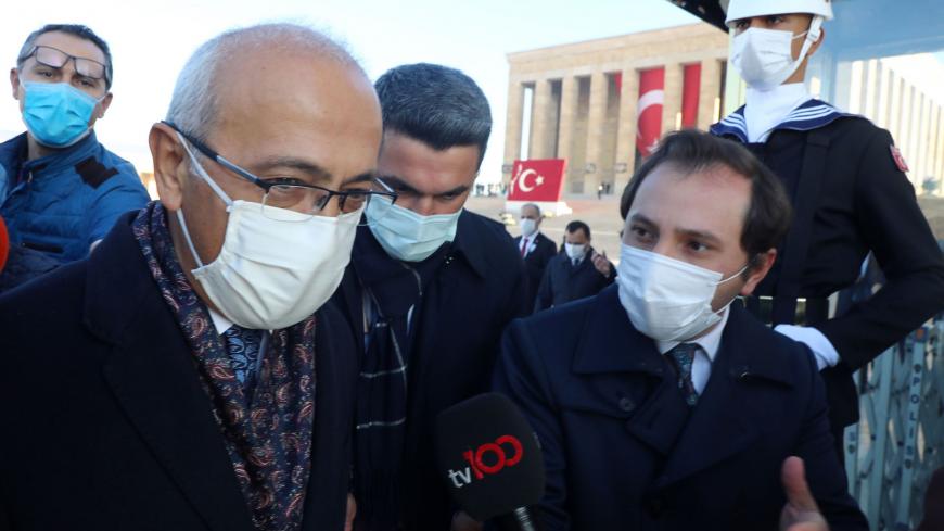 Newly appointed Treasury and Finance Minister Lutfi Elvan (L) speaks to media after attending a ceremony marking the 82th death anniversary of Mustafa Kemal Ataturk at the mausoleum in Ankara on November 10, 2020. - Turkey's lira surged to its biggest gain in two years on November 9, 2020, after President Recep Tayyip Erdogan's powerful son-in-law quit as finance minister following the abrupt appointment of a new central bank chief. (Photo by Adem ALTAN / AFP) (Photo by ADEM ALTAN/AFP via Getty Images)