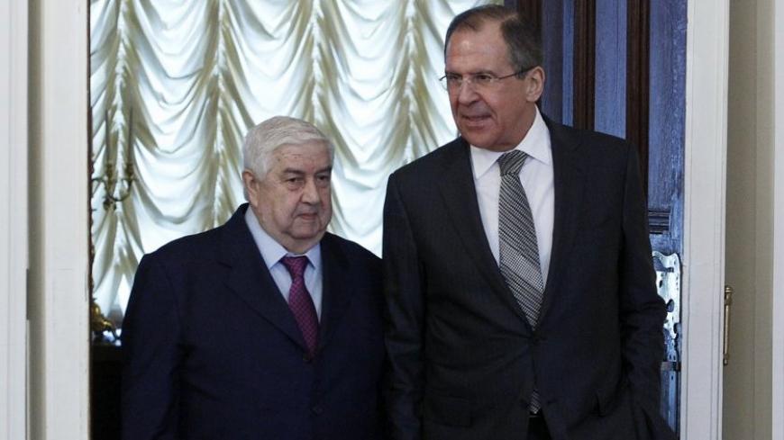 Russia's Foreign Minister Sergei Lavrov (R) and his Syrian counterpart Walid al-Moualem walk into a hall during a meeting in Moscow, February 25, 2013. Syrian Foreign Minister Walid al-Moualem said on Monday Damascus was ready to talk to the country's armed opposition, Russian news agency Itar-Tass reported. REUTERS/Sergei Karpukhin (RUSSIA - Tags: POLITICS) - RTR3E9P8