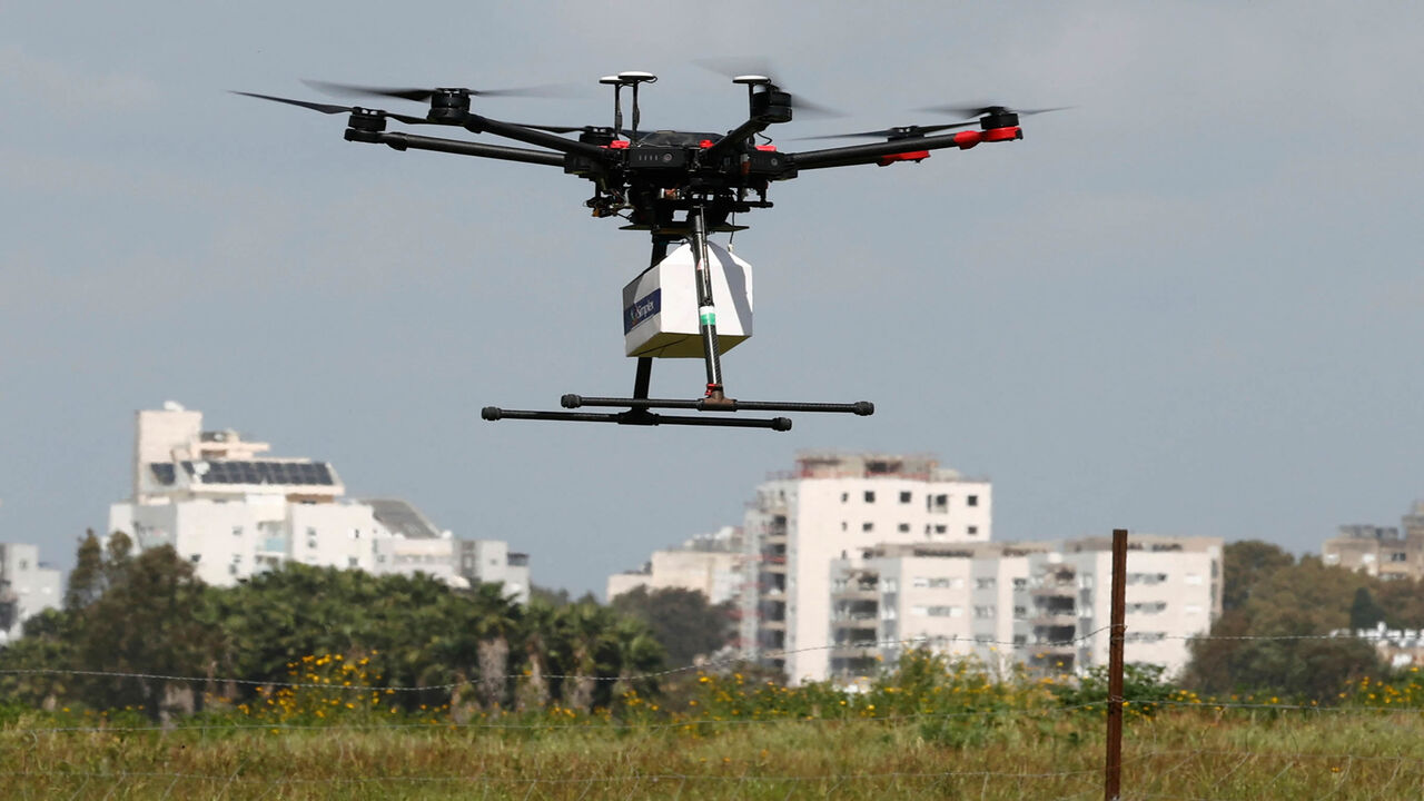 An unmanned aerial vehicle carries e-commerce products as part of a demonstration performed by the companies who won the tender for this project, Hadera, Israel, March 17, 2021.