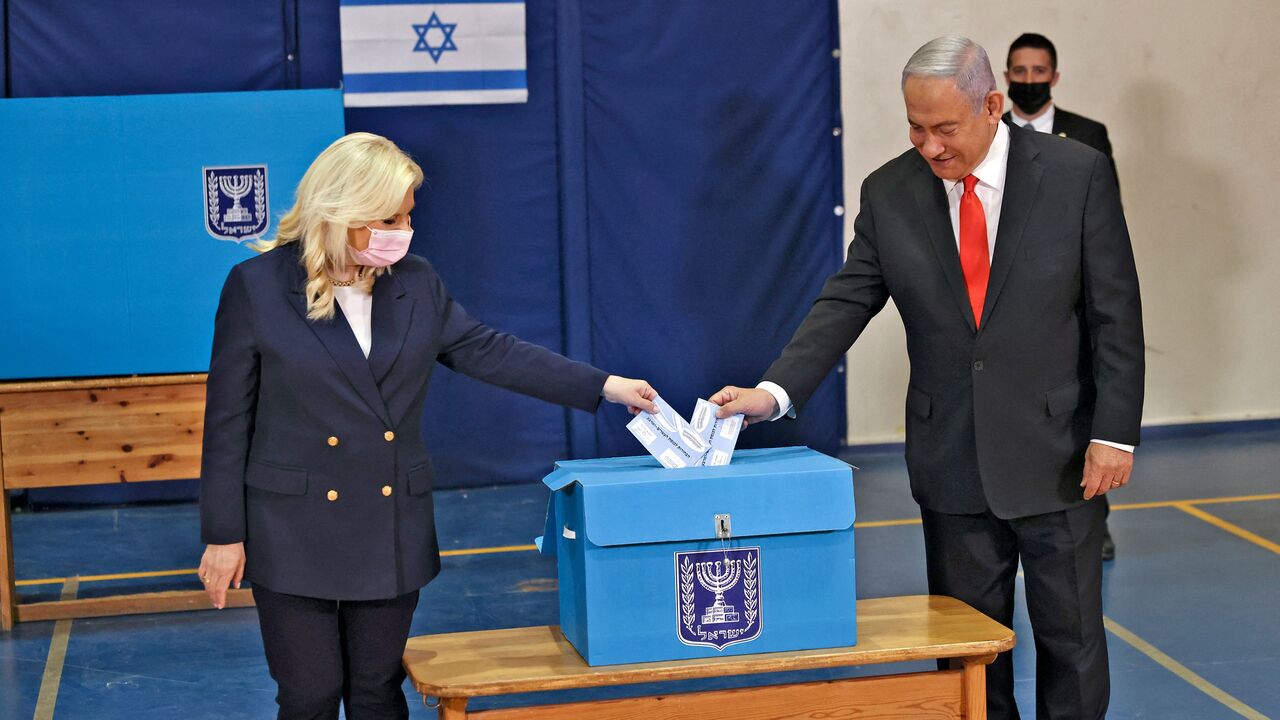 Benjamin and Sara Netanyahu vote 