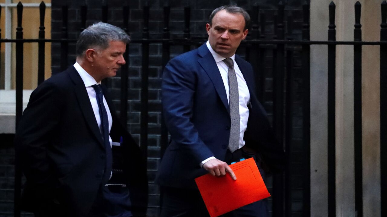 Britain's Foreign Secretary and First Secretary of State Dominic Raab (R) walks from the Foreign Office toward 10 Downing Street in central London on Jan. 6, 2020. The leaders of Germany, France and Britain on Sunday urged Iran to drop measures that go against the 2015 nuclear deal after Tehran announced it would no longer abide by a limit on enrichment.