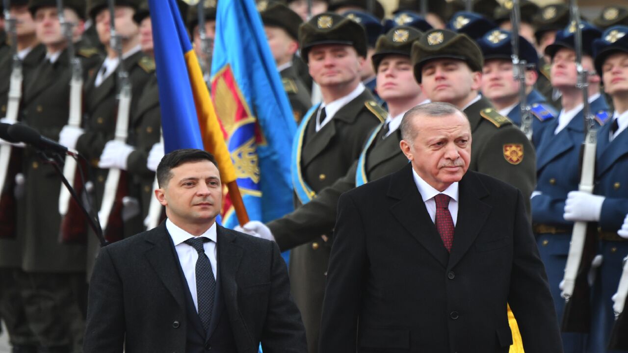 Ukrainian President Volodymyr Zelensky and his Turkish counterpart, Recep Tayyip Erdogan, review an honor guard during a welcoming ceremony prior to their talks in Kyiv on Feb. 3, 2020.