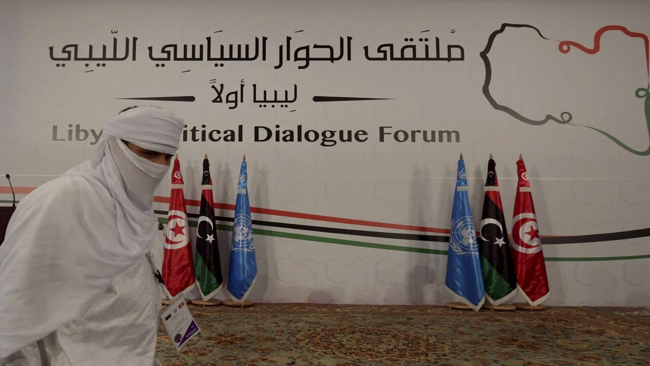 A delegate from Libya takes part in the Libyan Political Dialogue Forum hosted in Gammarth on the outskirts of Tunisia's capital, on Nov. 9, 2020. In October, the two main sides in the complex Libyan conflict signed a landmark cease-fire agreement.