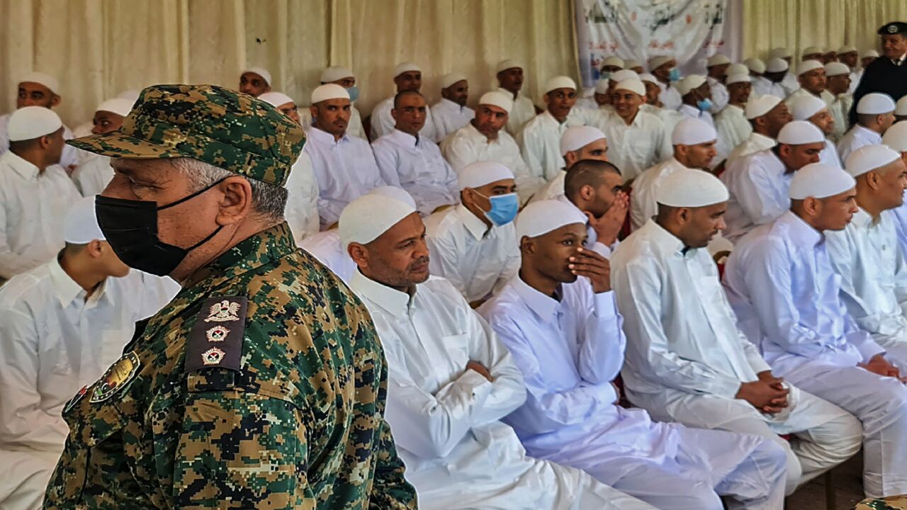 Prisoners of war loyal to the forces of Libya's eastern military strongman Khalifa Hifter are pictured after their liberation by the new Libyan unity government on March 31, 2021, in the port city of Zawiya, 50 kilometers (30 miles) west of the Libyan capital, Tripoli, following the latest peace deal between the North African country's former rival governments.