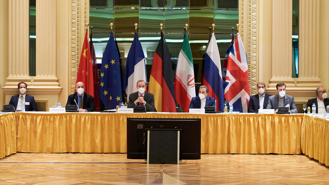In this handout provided by the EU Delegation in Vienna, Representatives of the European Union (L) and Iran (R) attend the Iran nuclear talks at the Grand Hotel on April 06, 2021 in Vienna, Austria. 