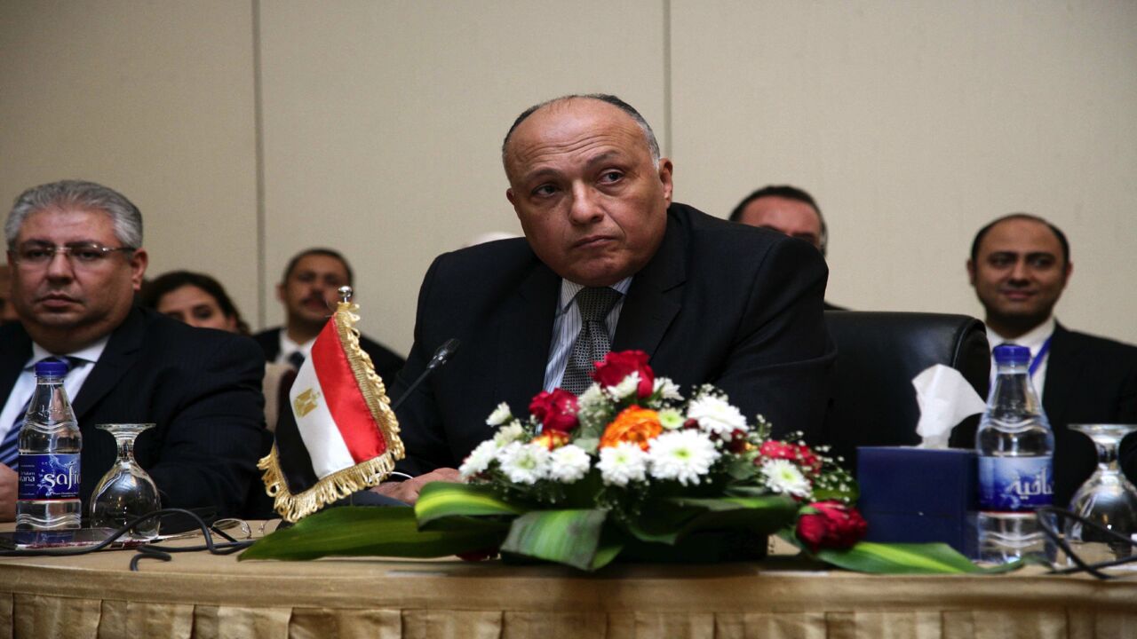 Egyptian Foreign Minister Sameh Shoukry (C) looks on during another round of talks on the Grand Ethiopian Renaissance Dam (GERD) project that has strained ties between Cairo and Addis Ababa in the Sudanese capital, Khartoum, on Dec. 29, 2015. 