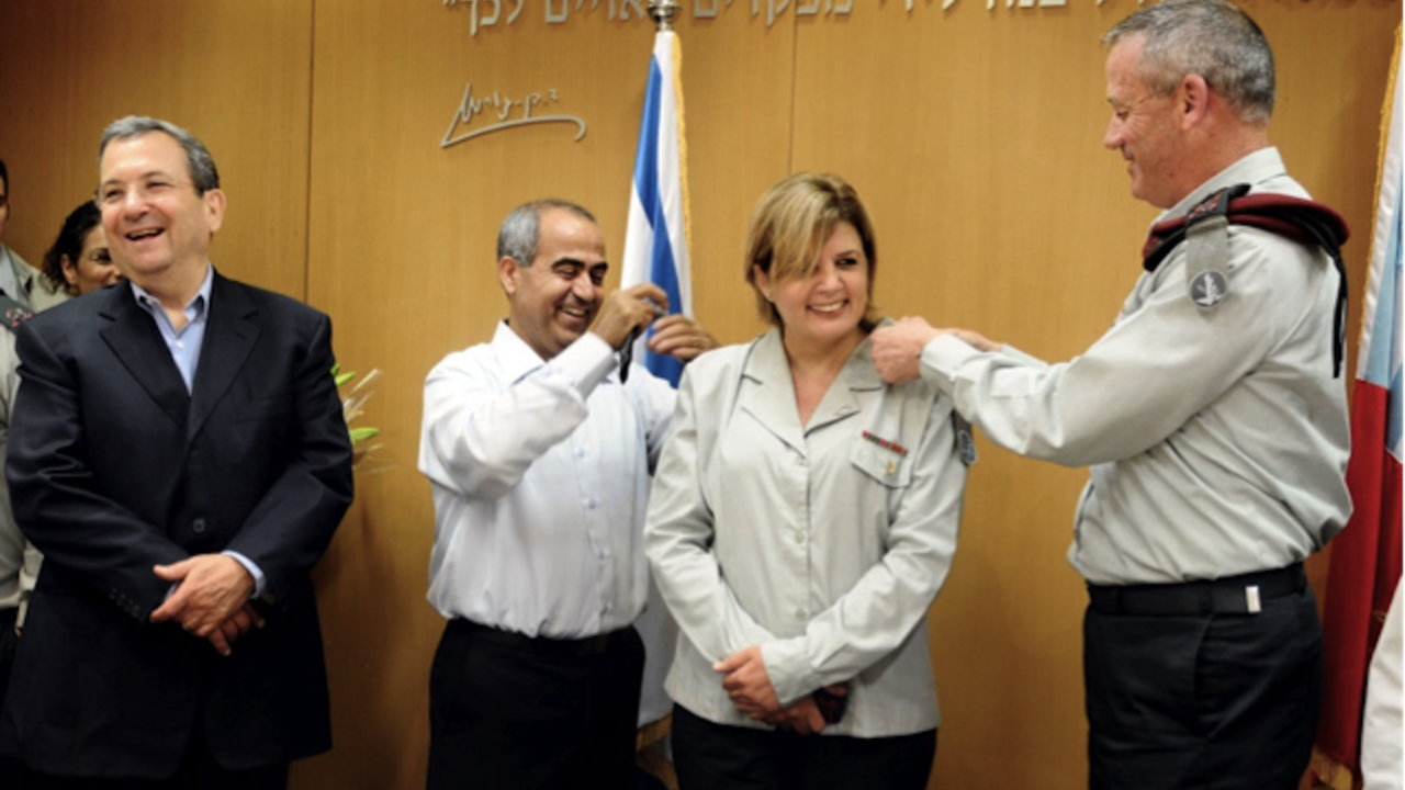 Orna Barbivai receives the rank of major general from Chief of Staff Lt. Gen. Benny Gantz as her husband and Defense Minister Ehud Barak look on, June 23, 2011.