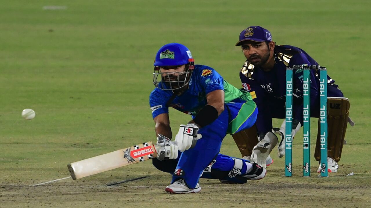 Multan Sultans' Mohammad Rizwan (L) plays a shot during the Pakistan Super League (PSL) T20 cricket match between Quetta Gladiators and Multan Sultans at the National Stadium in Karachi on March 3, 2021.