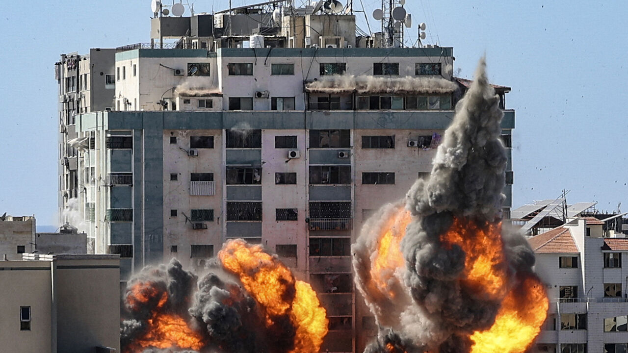 A ball of fire erupts from the Jala Tower as it is destroyed in an Israeli airstrike in Gaza City on May 15, 2021. The 13-floor Jala Tower housed the Qatar-based Al-Jazeera news and the Associated Press news agency. 