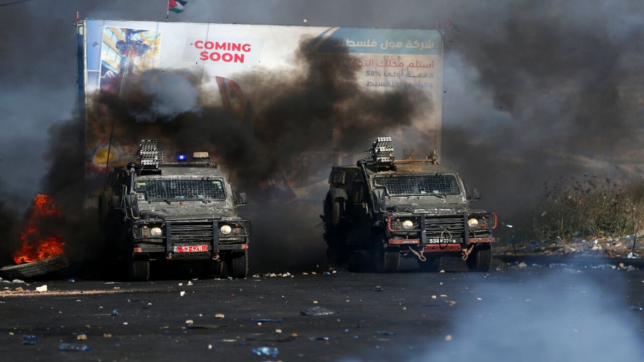 Israeli security forces deploy to disperse Palestinian protesters amid clashes near the settlement of Beit El and Ramallah in the occupied West Bank on May 18, 2021.