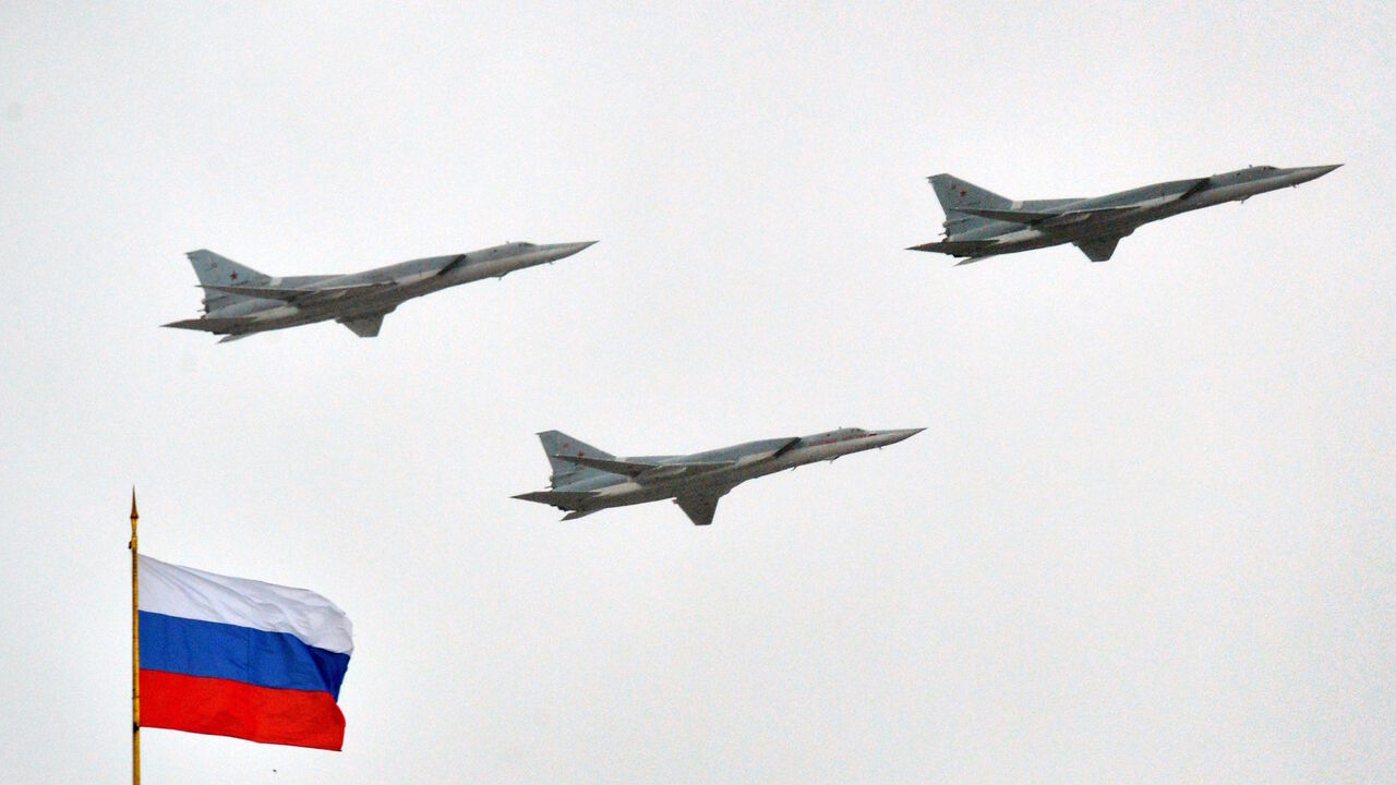 Russian Tupolev Tu-22M supersonic strategic bombers fly above the Kremlin in Moscow, on May 7, 2014, during a rehearsal of the Victory Day parade.