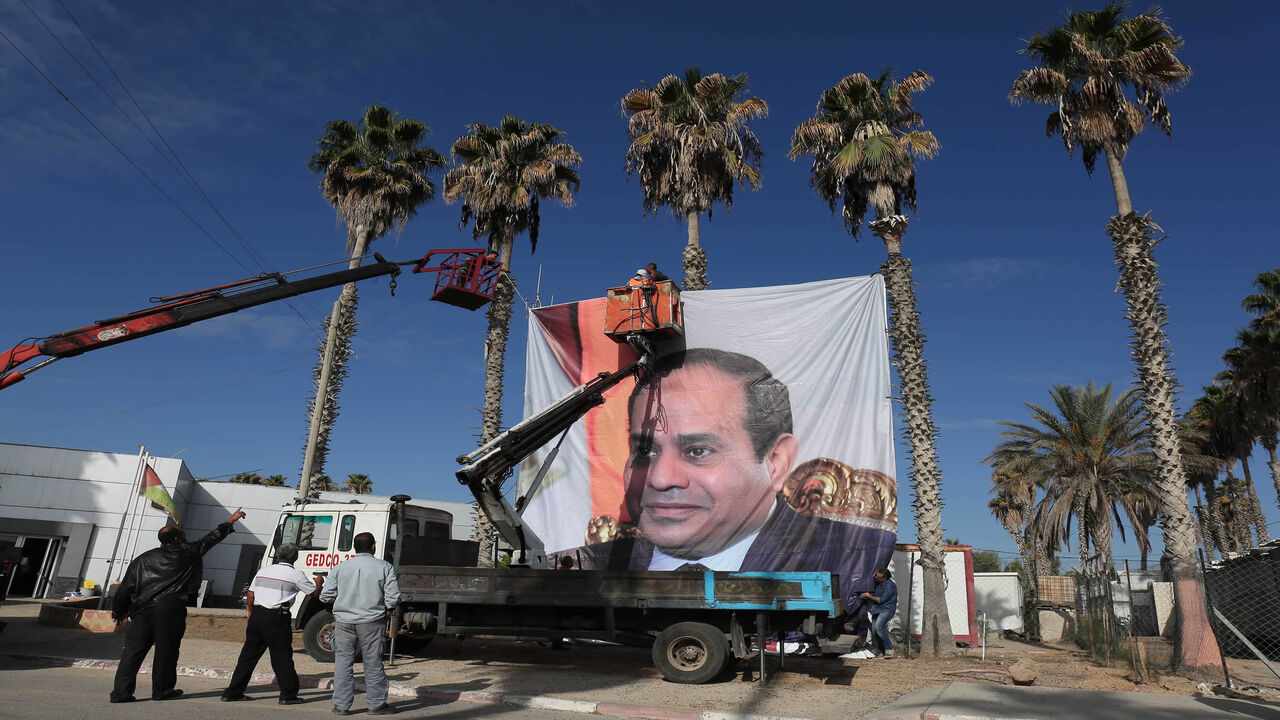 A portrait of Egyptian President Abdel Fattah al-Sisi is seen at the Rafah border crossing with Egypt, Nov. 1, 2017.