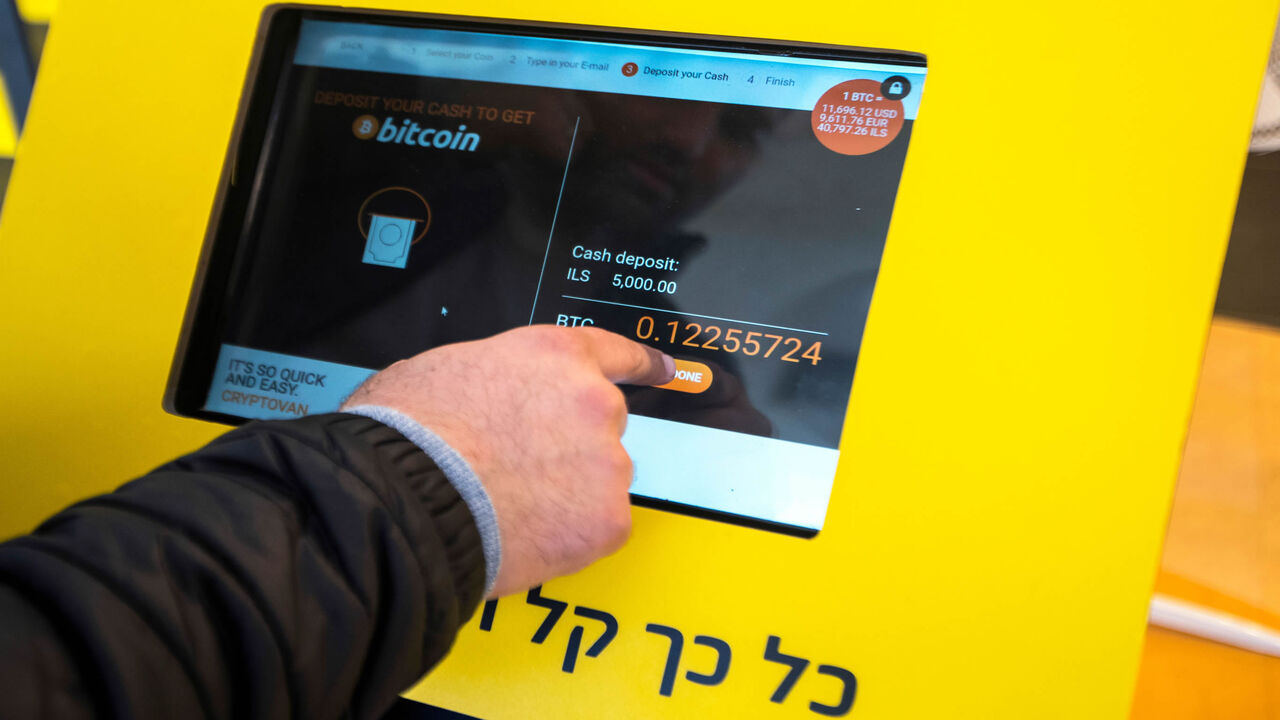 An Israeli buys Bitcoins, at the cryptocurrency "Bitcoin Change" shop, Tel Aviv, Israel, Jan. 17, 2018.