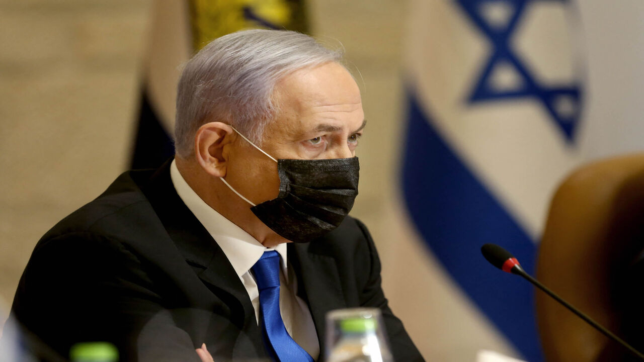 Israeli Prime Minister Benjamin Netanyahu, wearing a mask for protection against the coronavirus, attends a special Cabinet meeting on the occasion of Jerusalem Day at the city's municipality building, Jerusalem, May 9, 2021.