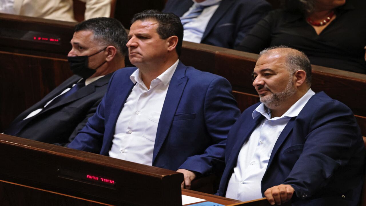 Israeli Knesset members (L to R) Gideon Saar, head of Israel's New Hope party, Ayman Odeh, leader of the predominantly Arab Joint List and the Hadash party, and Mansour Abbas, head of the conservative Islamic Raam party, attend a special session at the parliament in Jerusalem, on June 13, 2021.