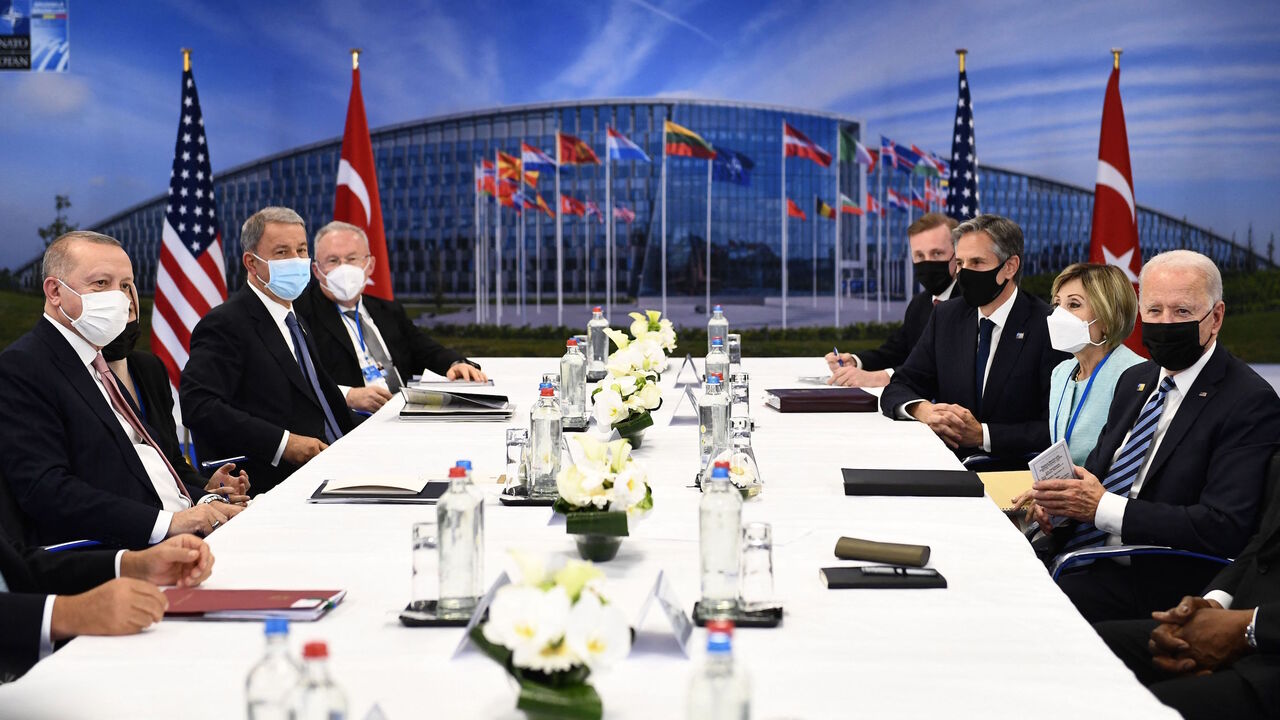 Turkey's President Recep Tayyip Erdogan (L) and US President Joe Biden (R) attend a bilateral meeting on the sidelines of the NATO summit at the North Atlantic Treaty Organization (NATO) headquarters in Brussels on June 14, 2021.
