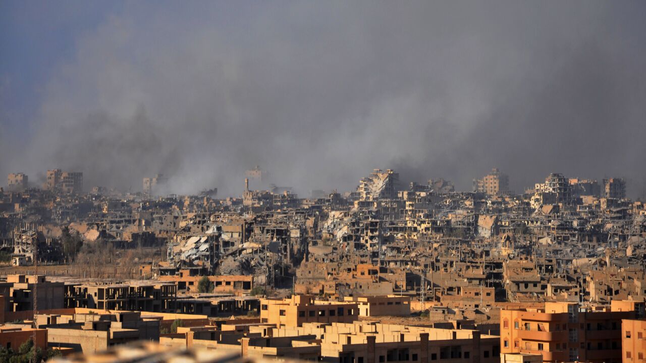 Smoke rises from buildings following an airstrike by Syrian government forces in the eastern city of Deir ez-Zor, on Oct. 31, 2017.