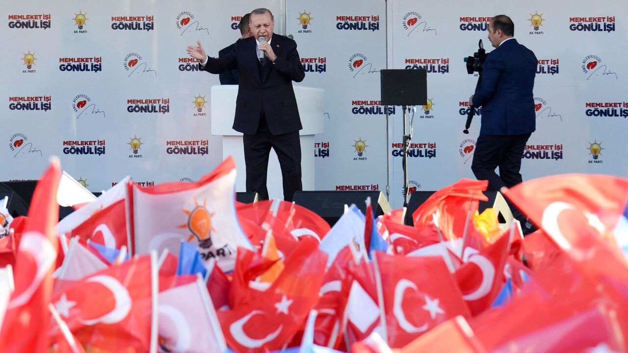 Turkish President Recep Tayyip Erdogan speaks on stage during a local election rally of his Justice and Development Party (AK Party) in Diyarbakir, eastern Turkey, on March 9, 2019. 