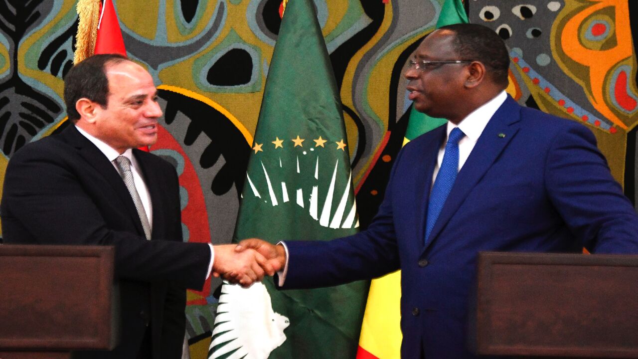 Egypt's President and current Chairperson of the African Union, Abdel Fattah al-Sisi (L), takes part in a joint press conference with Senegalese President Macky Sall at the Presidential Palace in Dakar for an official visit on April 12, 2019.