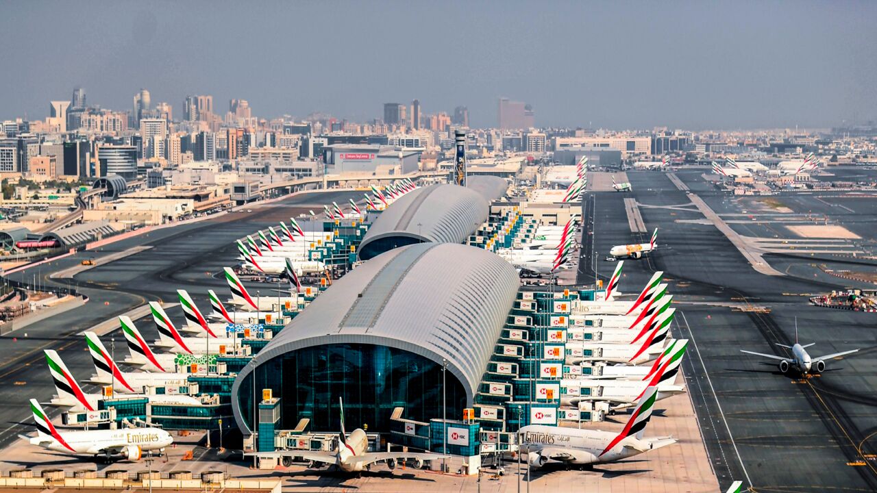 This picture taken on July 8, 2020, shows an aerial view of Emirates aircraft parked on the tarmac at Dubai International Airport.