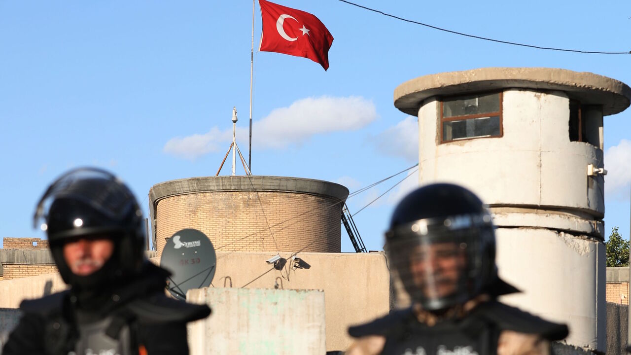 Iraqi riot police protect the Turkish embassy in Baghdad on Feb. 18, 2021 after calls on social media to gather outside the Turkish embassy to protest Turkey's vows to invade the northwestern enclave of Sinjar. 