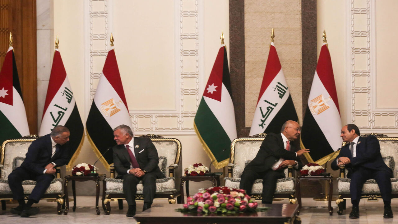 Iraqi President Barham Saleh (2-R) and Prime Minister Mustafa al-Kadhimi (L) receive Egyptian President Abdel Fattah al-Sisi (R) and Jordanian King Abdullah (2-L), Baghdad, Iraq,  June 27, 2021.