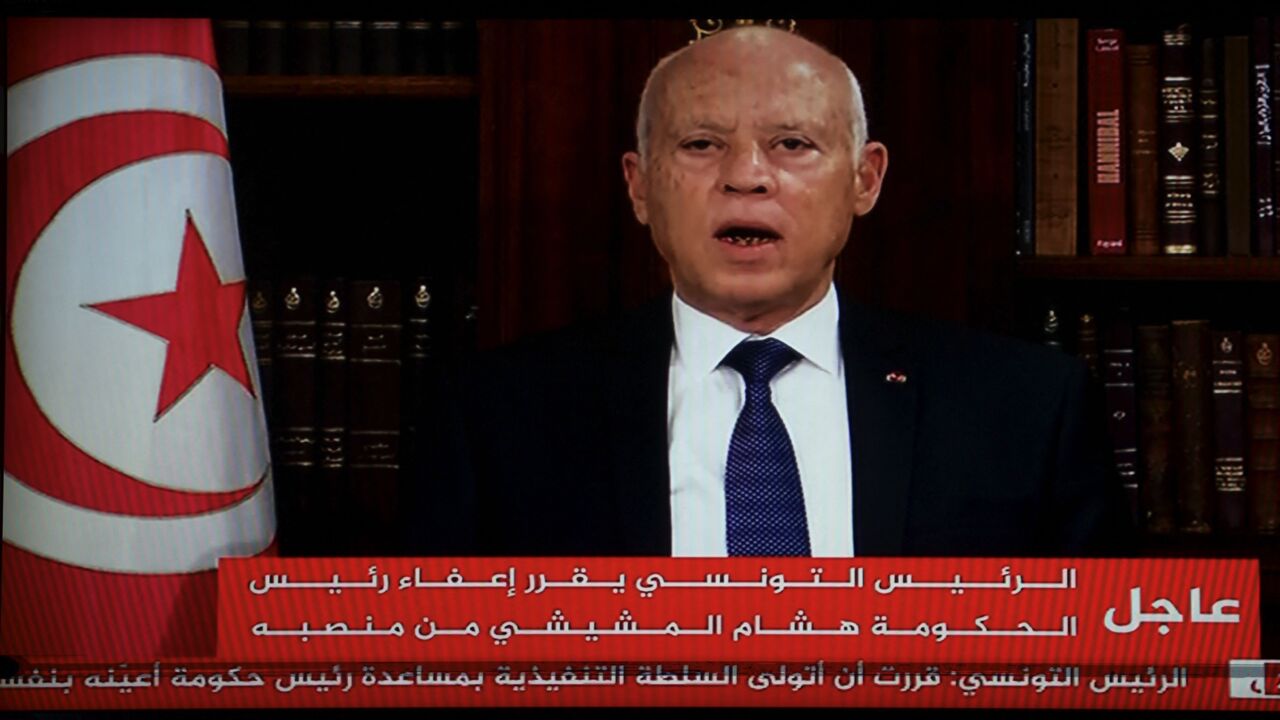 In a photo taken from the TV station of President Kais Saied, the president announces the dissolution of parliament and Prime Minister Mechichi's government on July 25, 2021.