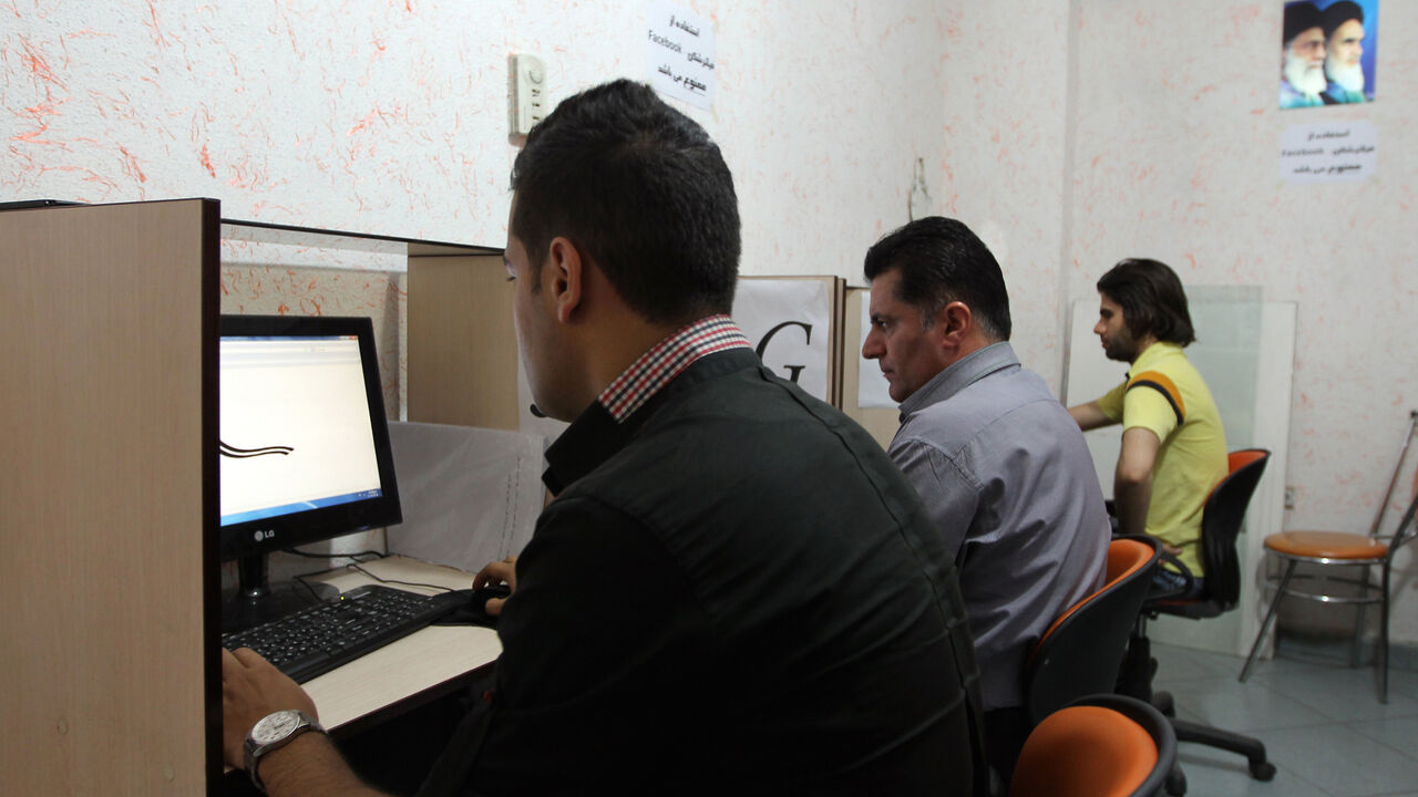 Iranians use internet at a cybercafe in the center of the Iranian capital Tehran on May 14, 2013. 