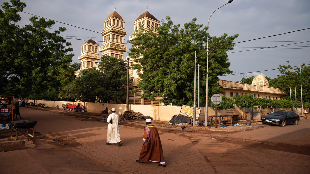 Muslim worshippers head to prayer in the Badalabougou neighborhood of Bamako during the Muslim holiday of Eid al-Adha, Mali, July 20, 2021.
