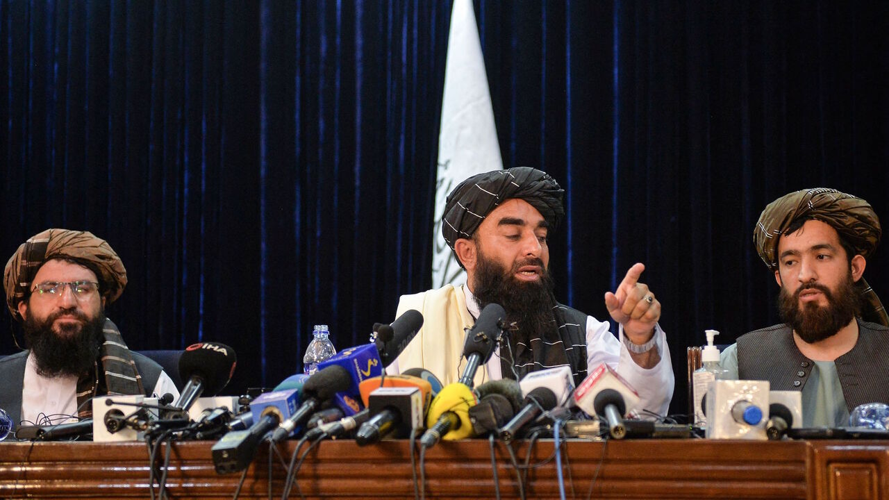 Taliban spokesperson Zabihullah Mujahid (C) gestures as he addresses the first press conference in Kabul on Aug. 17, 2021 following the Taliban stunning takeover of Afghanistan. 
