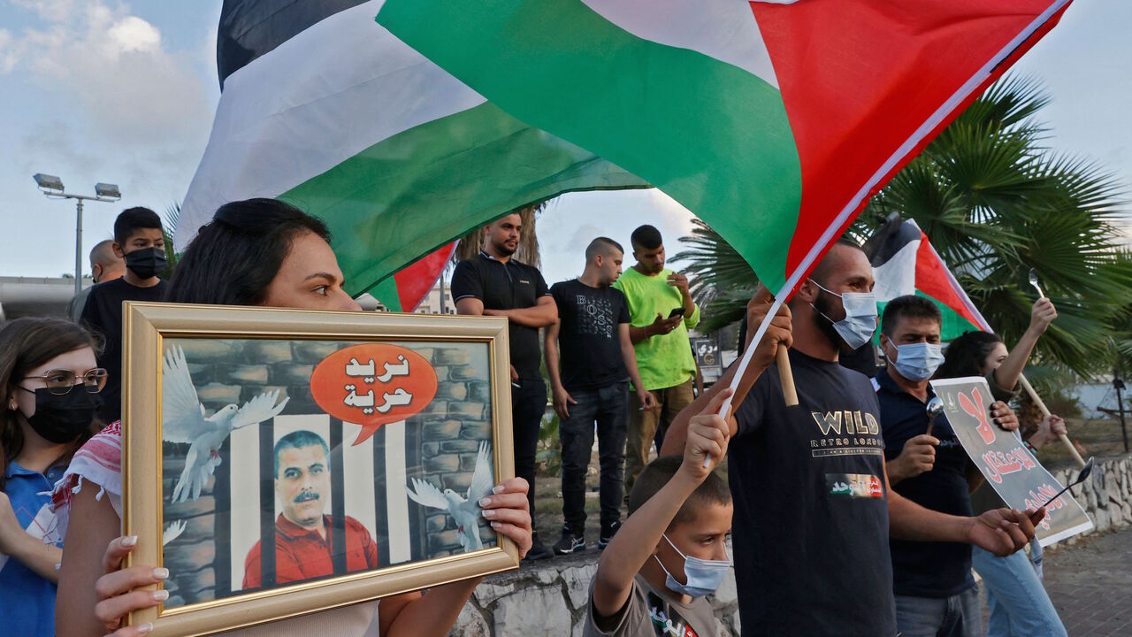 Arab Israeli protesters demonstrate in the mostly Arab city of Umm al-Fahm in northern Israel, on Sept. 10, 2021, to denounce punitive measures taken by the Israel Prison Service against Palestinian prisoners, after six of them escaped from the northern Gilboa prison. 