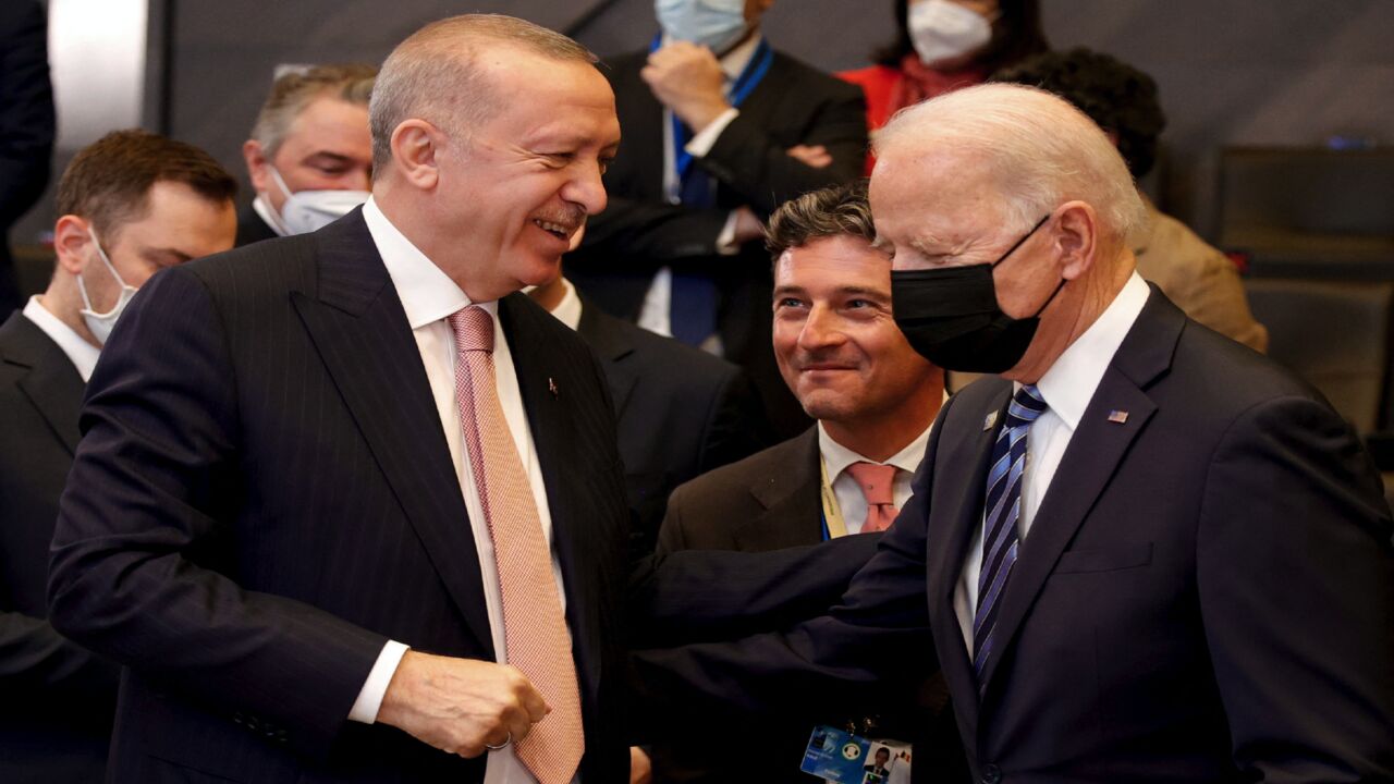 US President Joe Biden (R) speaks with Turkey's President Recep Tayyip Erdogan.
